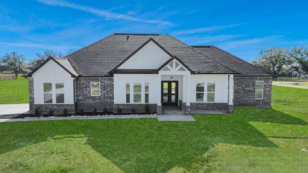 Front exterior of a new home in , Rosharon, TX, highlighting curb appeal (Image 27).