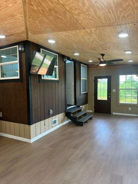 A versatile living space with light wood flooring and ample natural light.