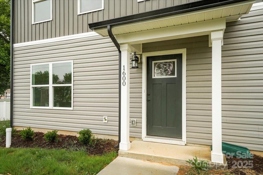 Front exterior of a new home in , Albemarle, NC, highlighting curb appeal (Image 21).