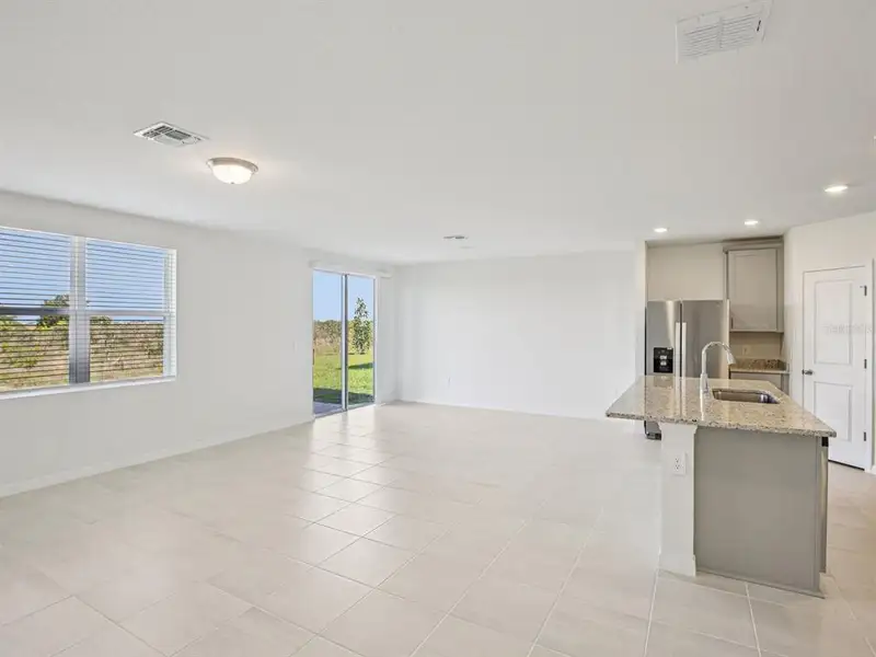 Spacious, unfurnished interior of a new home in The Reserve at Hammock Oaks - Signature Series, Lady Lake (Image 7).