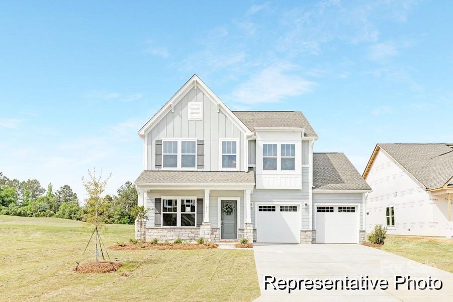 Front exterior of a new home in Morgan Hills, Albemarle, NC, highlighting curb appeal (Image 1).
