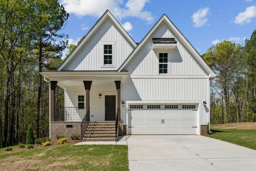 Representative exterior photo of a completed home built from the Taylor by HHHunt Homes LLC in Magnolia Acres, Fuquay Varina, NC (Image 63). Representative exterior photo of a completed home built from the Taylor by HHHunt Homes LLC in Magnolia Acres, Fuquay Varina, NC (Image 63).