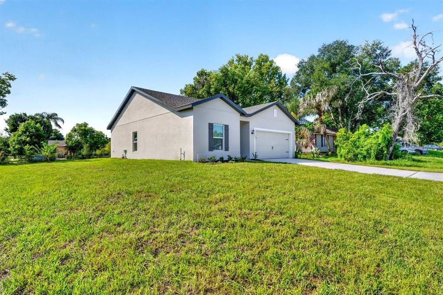 Front exterior of a new home in , Deltona, FL, highlighting curb appeal (Image 16). Front exterior of a new home in , Deltona, FL, highlighting curb appeal (Image 16).