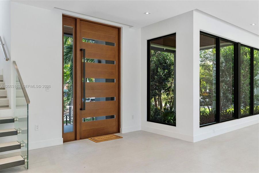 Foyer and ample luminous living/dining area