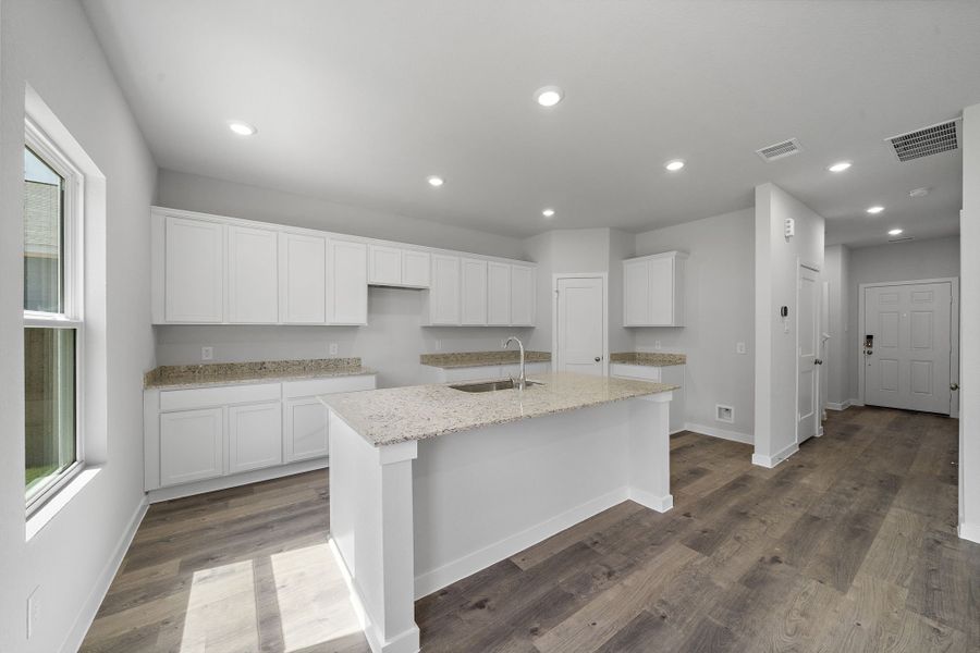 A kitchen with white cabinets. A kitchen with white cabinets.