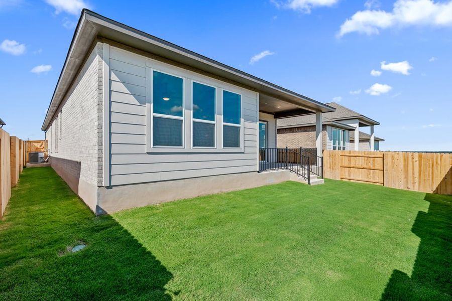 Exterior details and patio area of a home in Arbor Collection at Lariat, Liberty Hill (Image 25). Exterior details and patio area of a home in Arbor Collection at Lariat, Liberty Hill (Image 25).