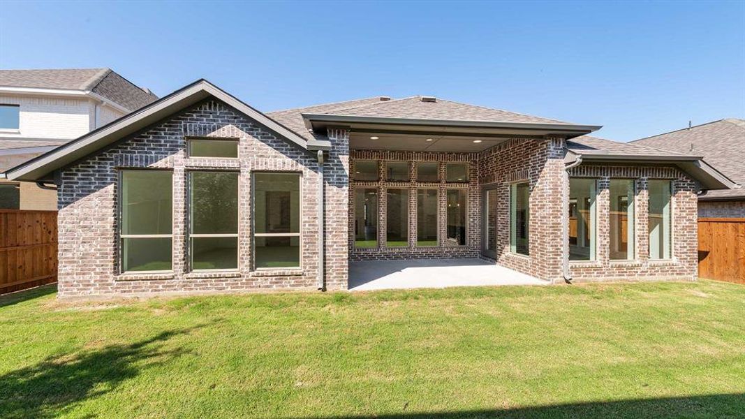 Front exterior of a new home in The Heights At Uptown Celina 50', Celina, TX, highlighting curb appeal (Image 2). Front exterior of a new home in The Heights At Uptown Celina 50', Celina, TX, highlighting curb appeal (Image 2).