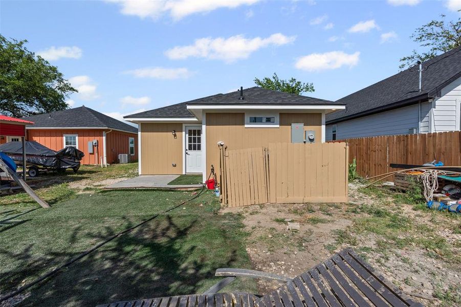 Rear view of property with a patio and roof with shingles Rear view of property with a patio and roof with shingles