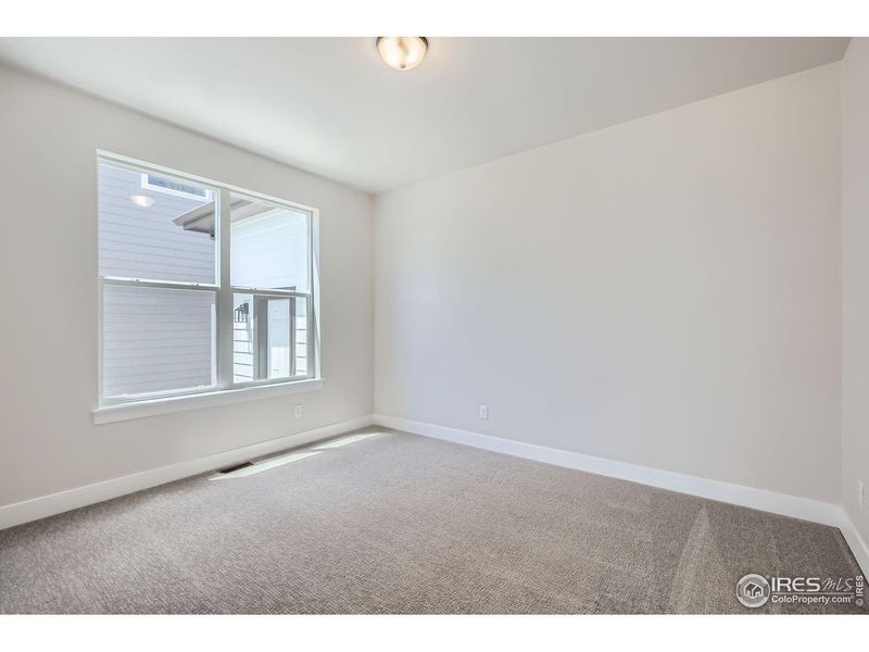Spacious, unfurnished interior of a new home in RainDance, Windsor (Image 22).