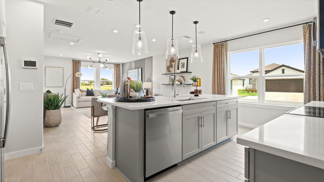 Farmhouse style Kitchen in this New Construction Home in Winter Haven Florida by DRB Homes the Jupiter in Willowbrook North