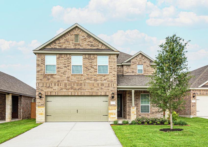 Brick and stone exterior with front yard landscaping