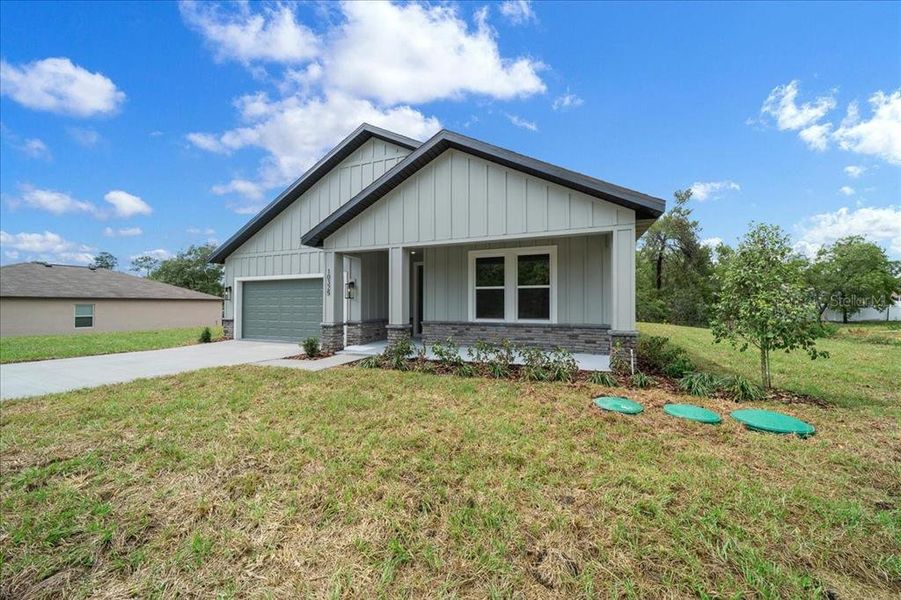 Front exterior of a new home in , Weeki Wachee, FL, highlighting curb appeal (Image 28). Front exterior of a new home in , Weeki Wachee, FL, highlighting curb appeal (Image 28).