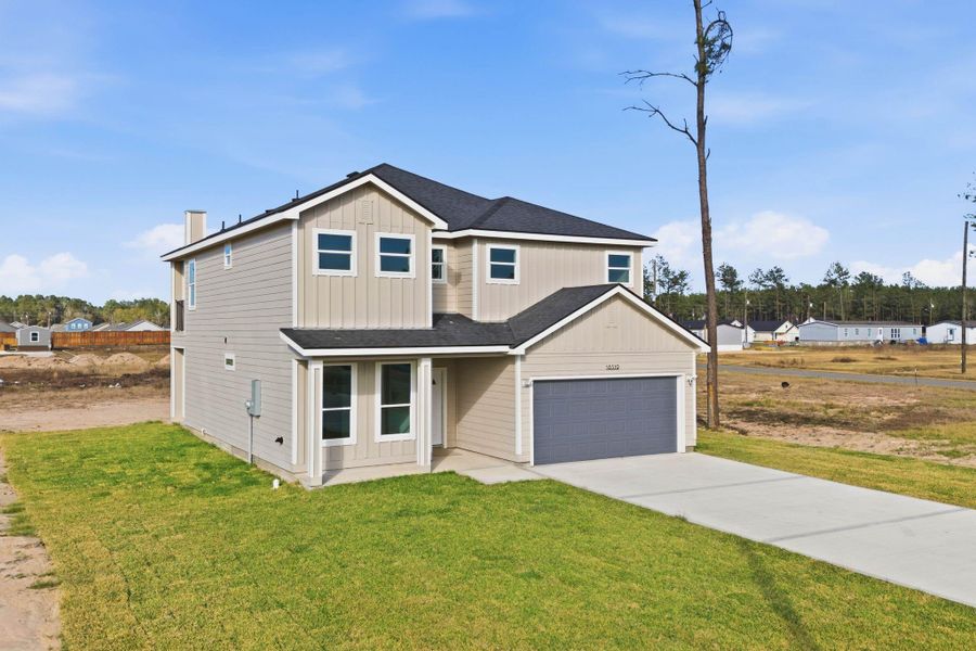 Front exterior of a new home in , Conroe, TX, highlighting curb appeal (Image 21).