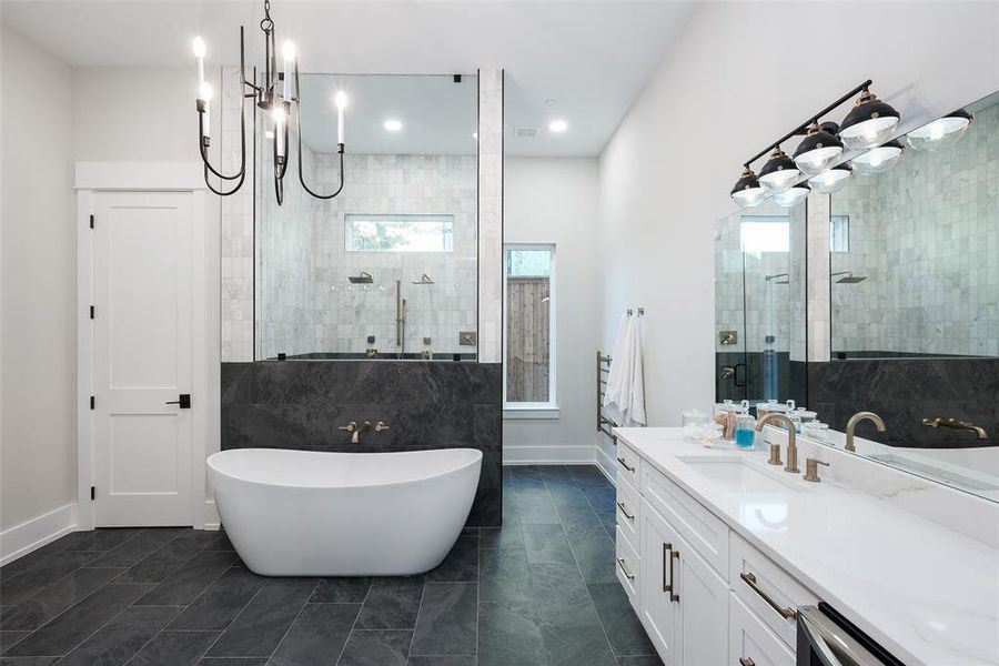 Bathroom with plus walk in shower, vanity, and tile patterned floors