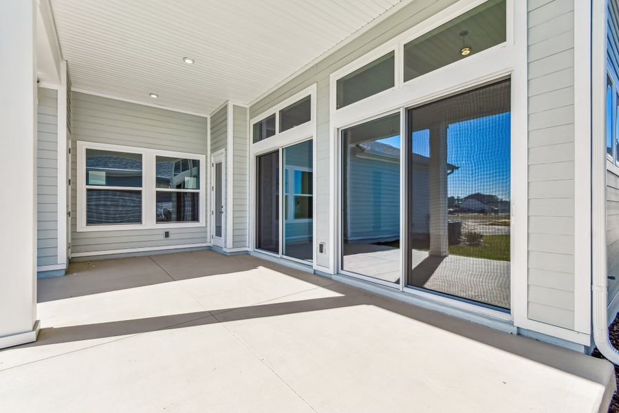 Exterior details and patio area of a home in Seven Pines 50' Rear Entry, Jacksonville (Image 3).
