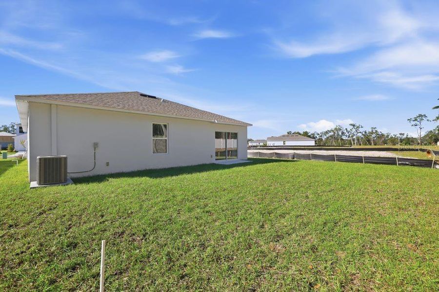 Exterior details and patio area of a home in Palm Wind, Hudson (Image 3).