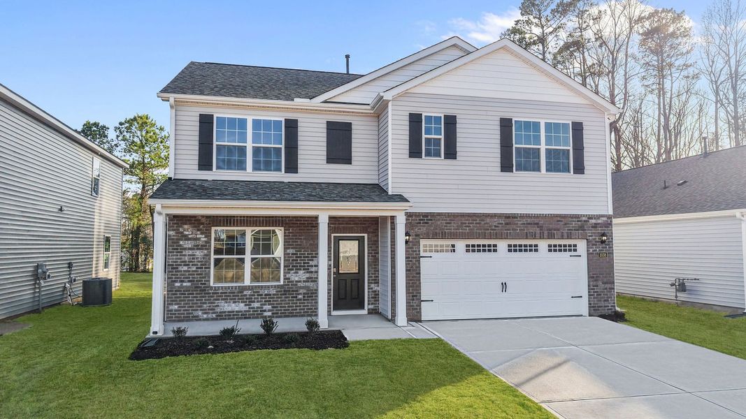 Front exterior of a new home in Bedford Place, Wilson, NC, highlighting curb appeal (Image 22).