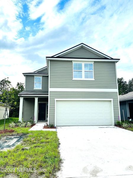 Front exterior of a new home in Cross Creek Express, Green Cove Springs, FL, highlighting curb appeal (Image 21). Front exterior of a new home in Cross Creek Express, Green Cove Springs, FL, highlighting curb appeal (Image 21).