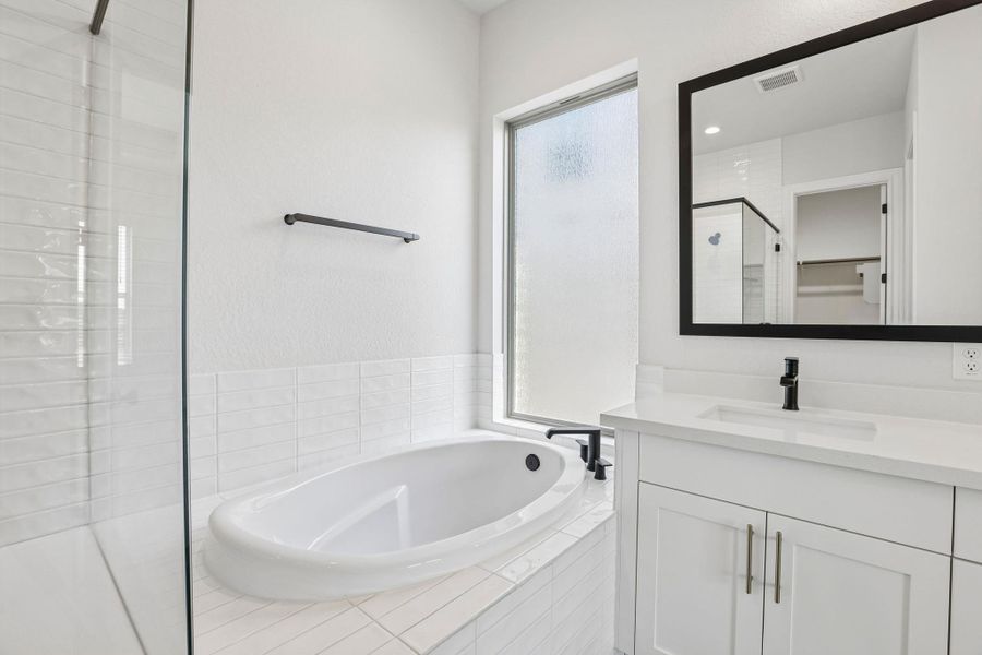 Furnished interior view inside a new home in 6 Creeks, Kyle (Image 9).