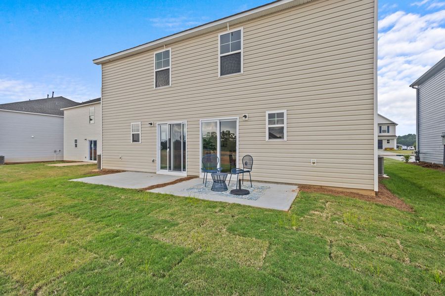 Exterior details and patio area of a home in Champions Village at Cherry Hill, Pendleton (Image 31).