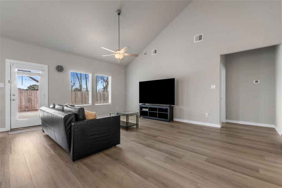 Spacious and light-filled living area designed for comfort and everyday living. The open layout provides ample room for seating and entertainment, with large windows that allow natural light to flow throughout the space.