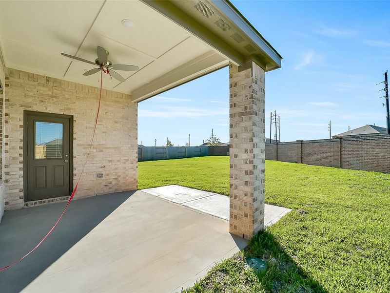 Exterior details and patio area of a home in Sunterra, Katy (Image 4).