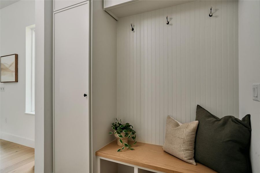 Mudroom with light wood-style flooring Mudroom with light wood-style flooring