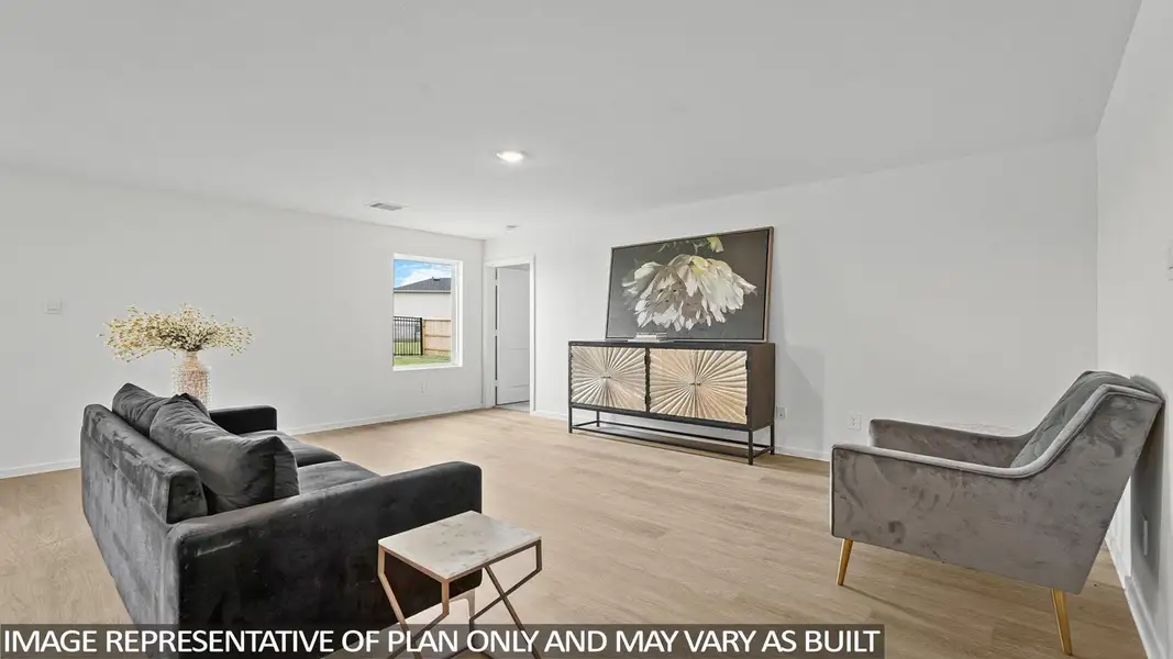 Furnished interior view inside a new home in Sunterra, Katy (Image 3).