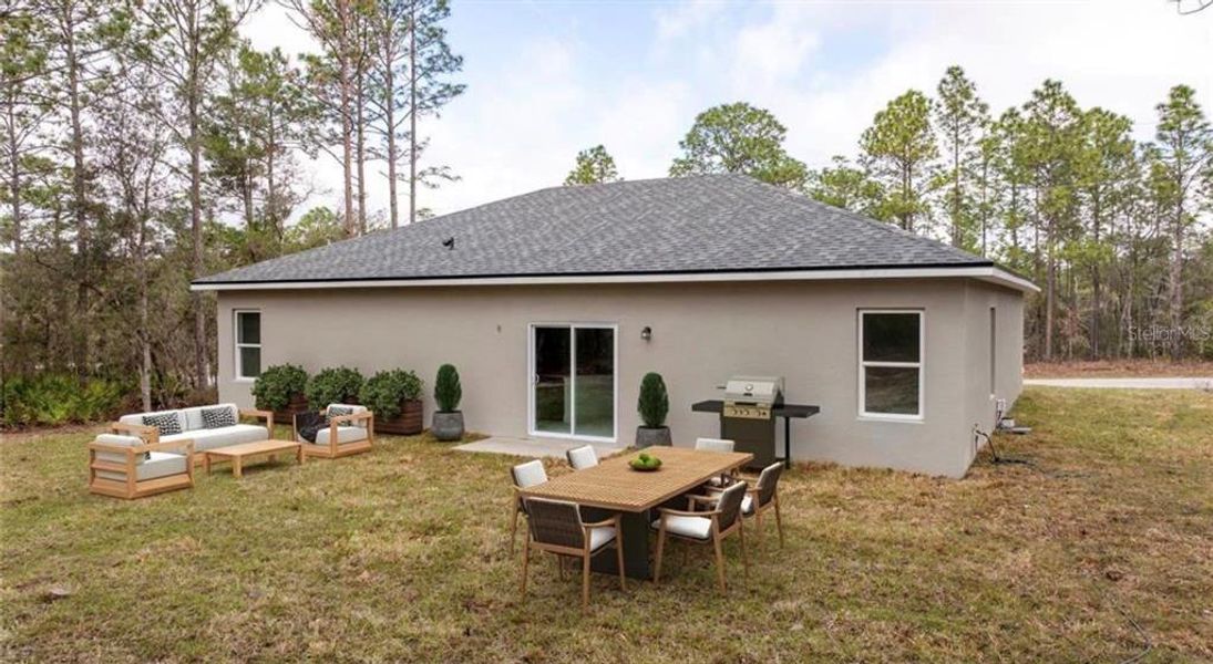Exterior details and patio area of a home in , Citrus Springs (Image 30).