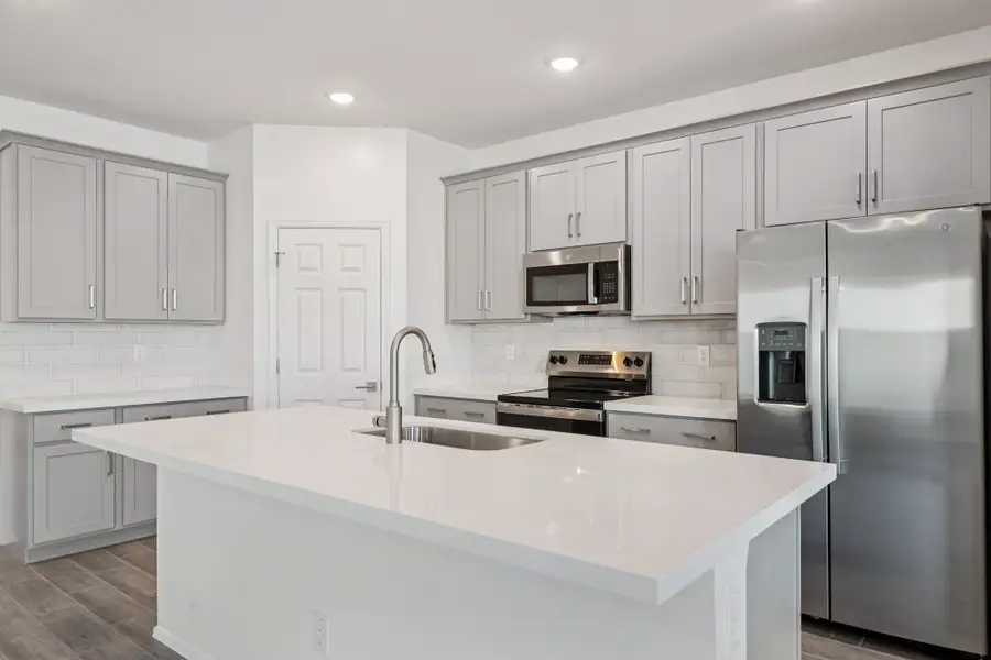 Kitchen featuring the Milan Collection. Finishes and options may vary by community
