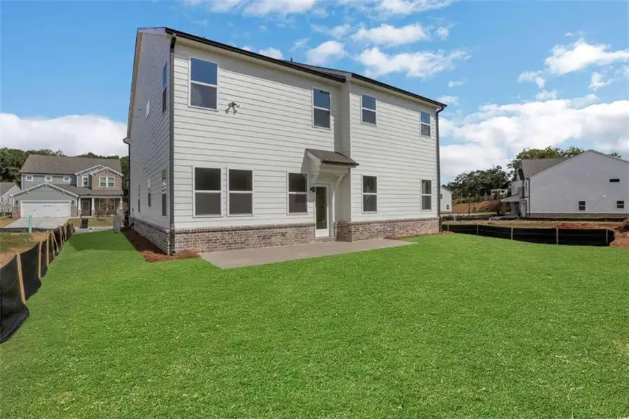 Exterior details and patio area of a home in The Paddocks at Doc Hughes, Buford (Image 3).