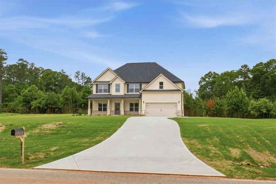 Front exterior of a new home in , Stockbridge, GA, highlighting curb appeal (Image 20).