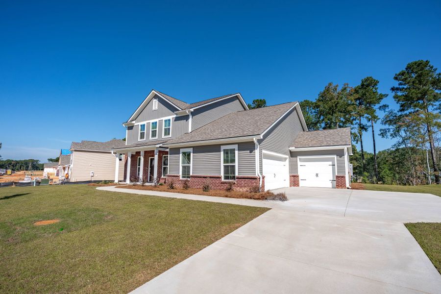 Front exterior of a new home in Oakleaf Chase, Blythewood, SC, highlighting curb appeal (Image 20).