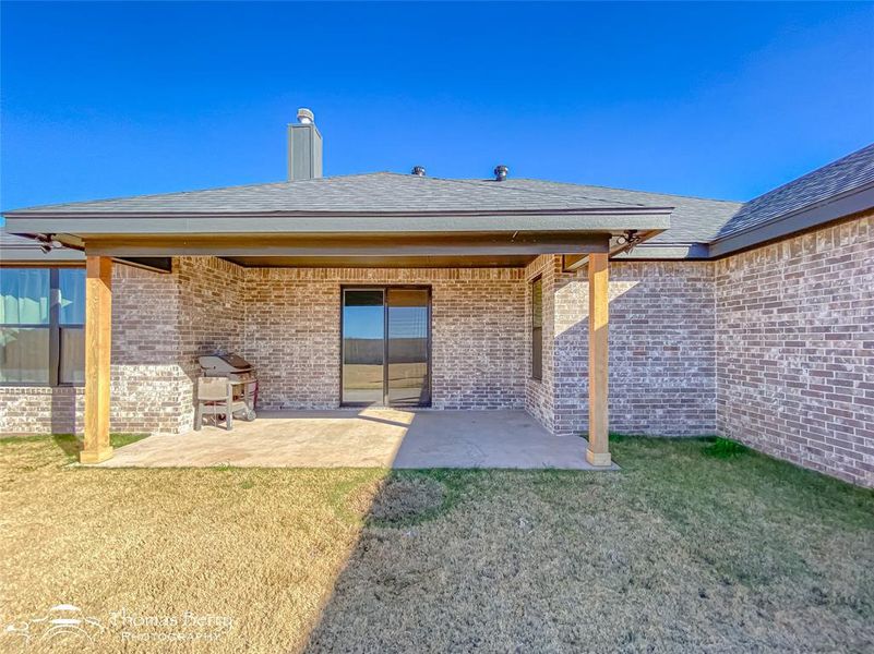 Oversized covered back patio.