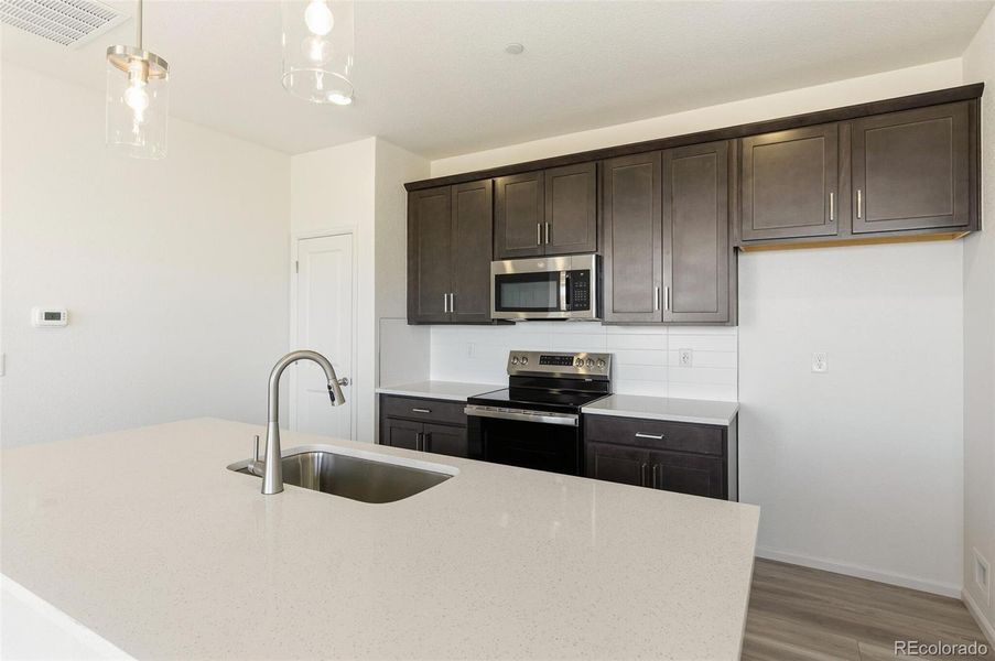 Furnished interior view inside a new home in Turnberry, Commerce City (Image 14).