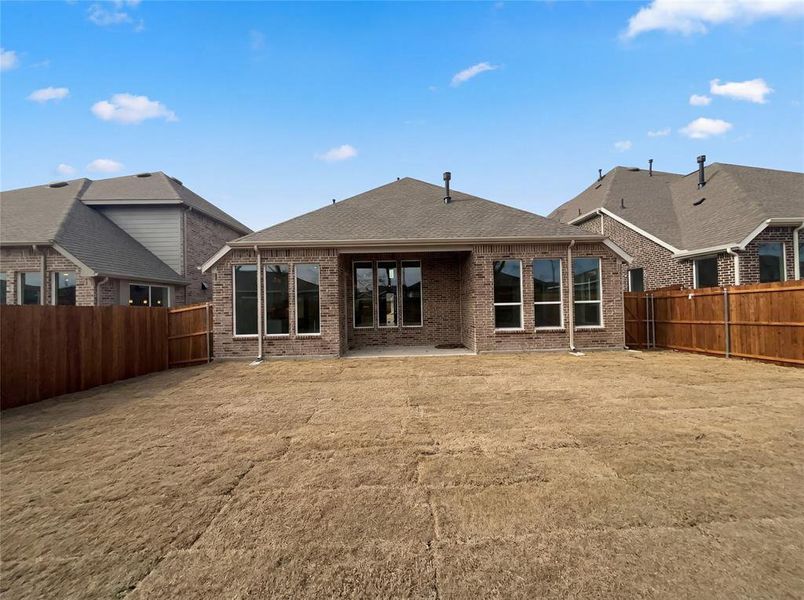 Exterior details and patio area of a home in Shaded Tree, McKinney (Image 16).