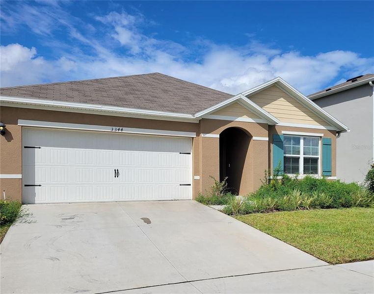 Front exterior of a new home in , Lakeland, FL, highlighting curb appeal (Image 14).