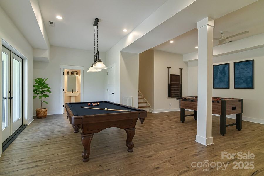Rec room for family fun. Virtually staged.