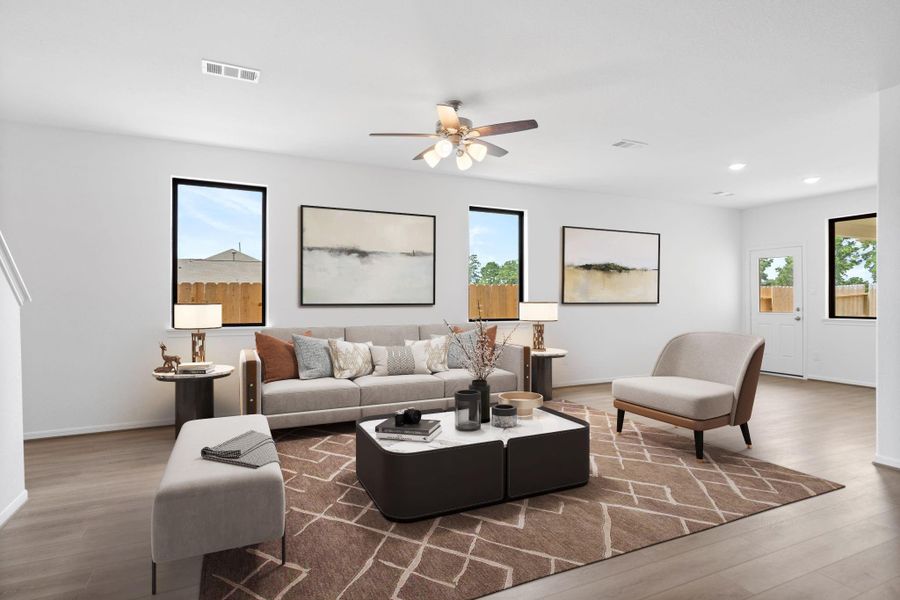 Your family room has ample space to entertain family and friends. This space features beautiful floors, fresh paint, ceiling fan with lighting, and high ceilings.