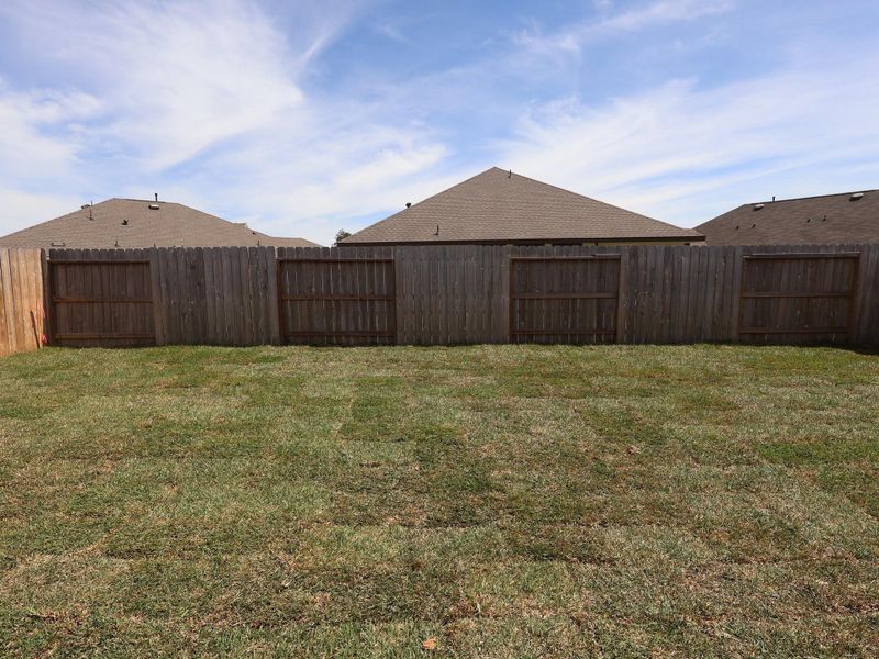 Exterior details and patio area of a home in Pinewood at Grand Texas, New Caney (Image 4).