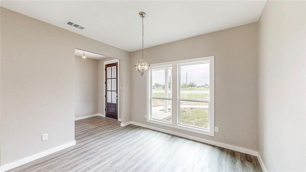 Glass front door with inviting entry