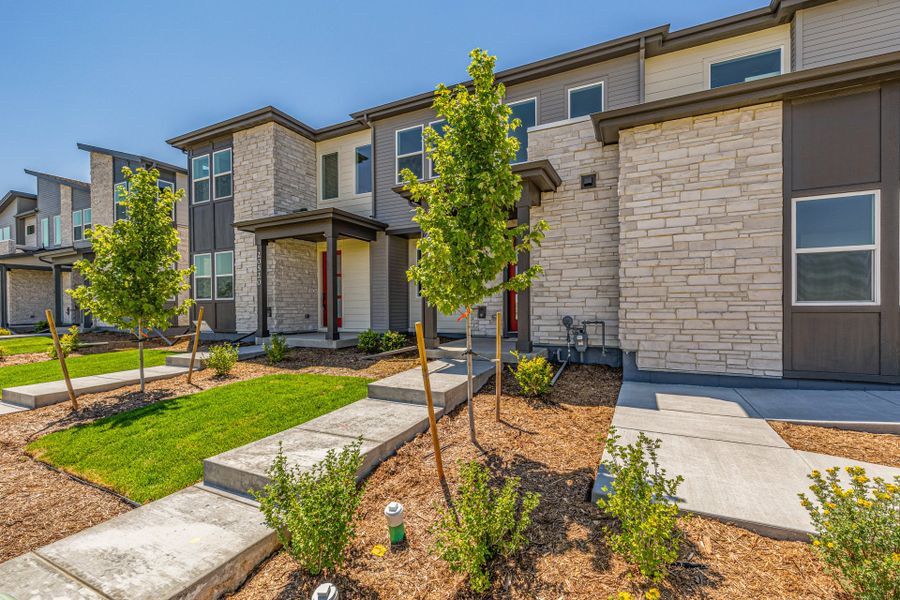 Front exterior of a new home in Painted Prairie, Aurora, CO, highlighting curb appeal (Image 21).