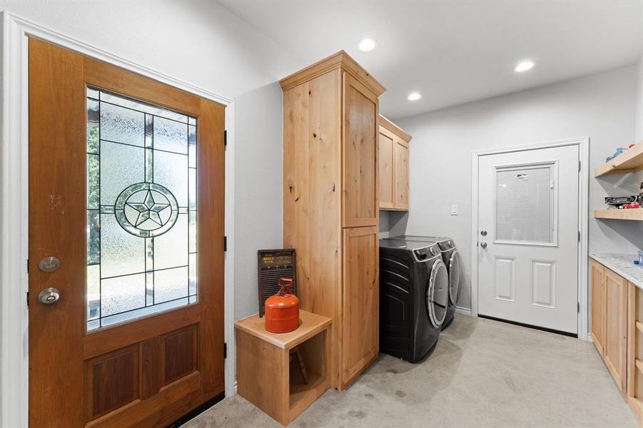Back door with laundry, mud area, and large walk in pantry with full washer/dryer area.