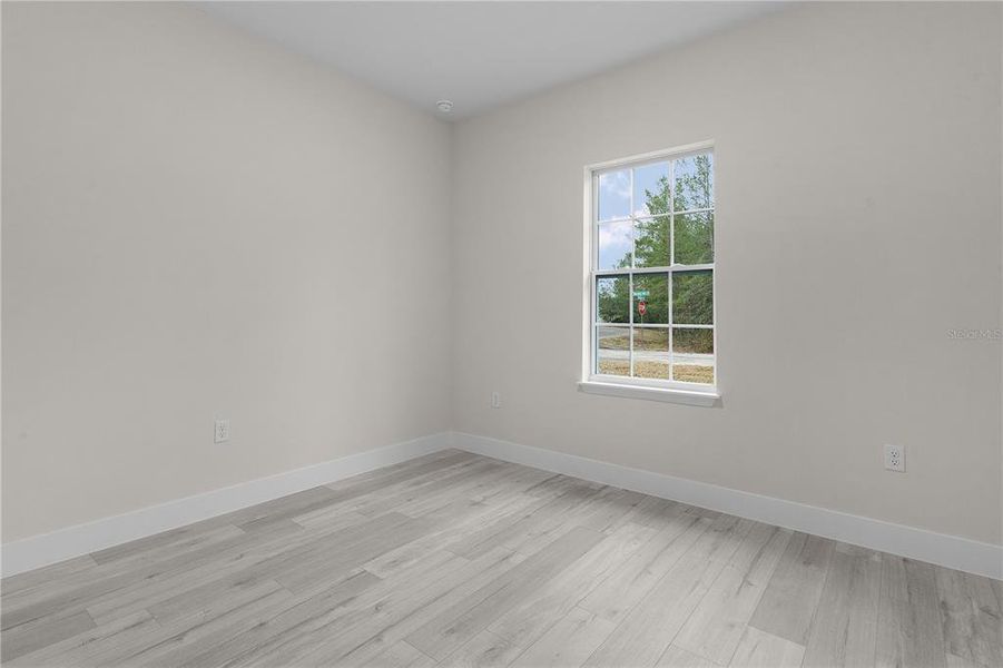 Bedroom 2 with window toward the street out front