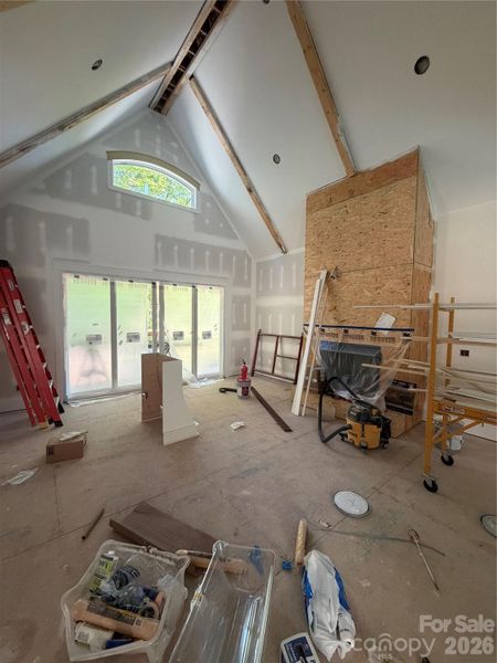 Living room with vaulted, 20ft, ceiling & soon to be stone fireplace