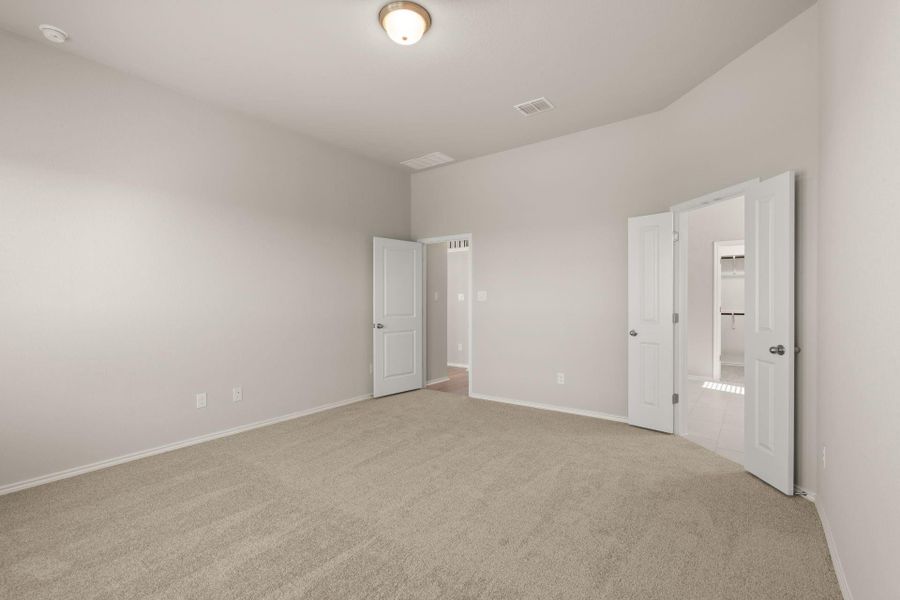 Primary Bedroom with french doors to Primary Bath