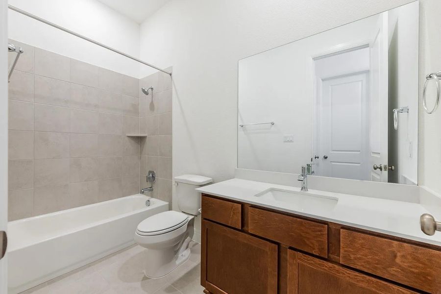 Furnished interior view inside a new home in The Colony - 50', Bastrop (Image 9).