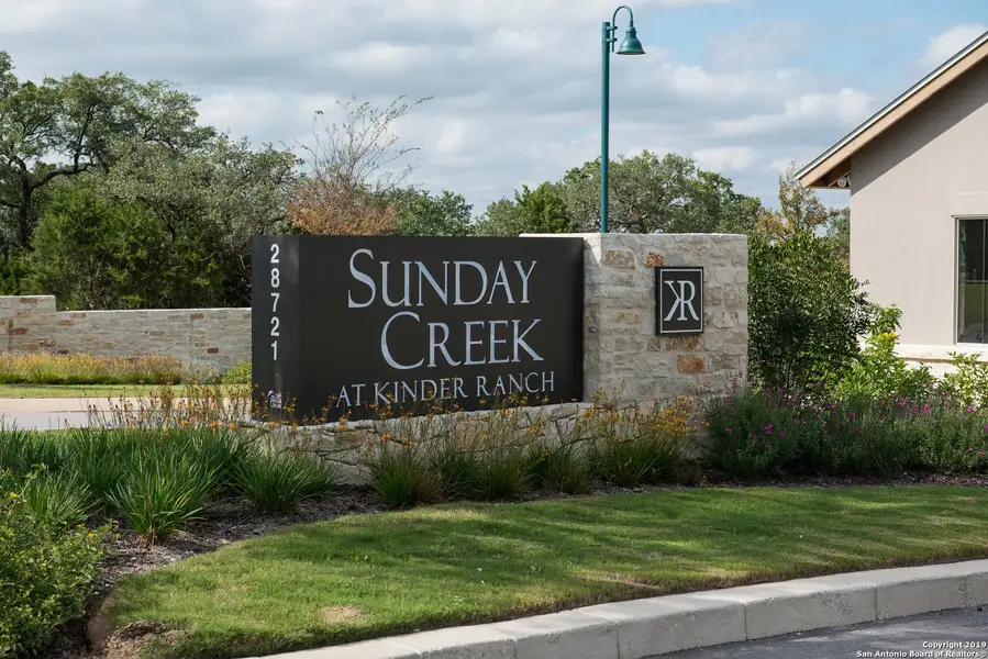 Front exterior of a new home in Sunday Creek at Kinder Ranch, San Antonio, TX, highlighting curb appeal (Image 10). Front exterior of a new home in Sunday Creek at Kinder Ranch, San Antonio, TX, highlighting curb appeal (Image 10).