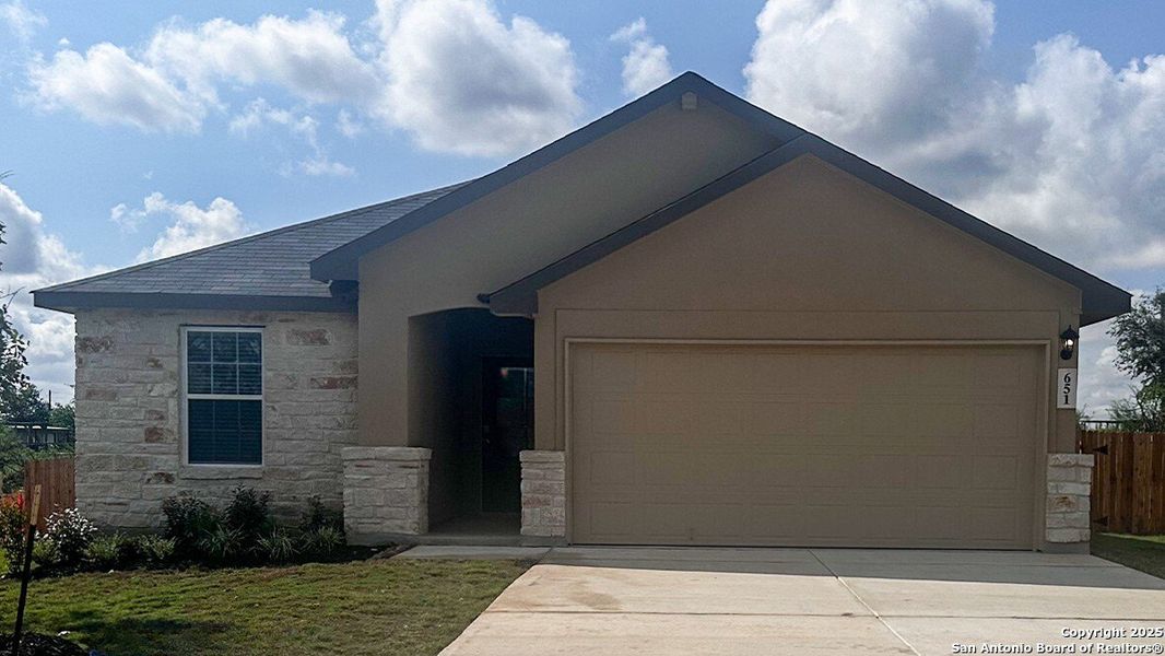 Front exterior of a new home in Steele Creek, Cibolo, TX, highlighting curb appeal (Image 2). Front exterior of a new home in Steele Creek, Cibolo, TX, highlighting curb appeal (Image 2).