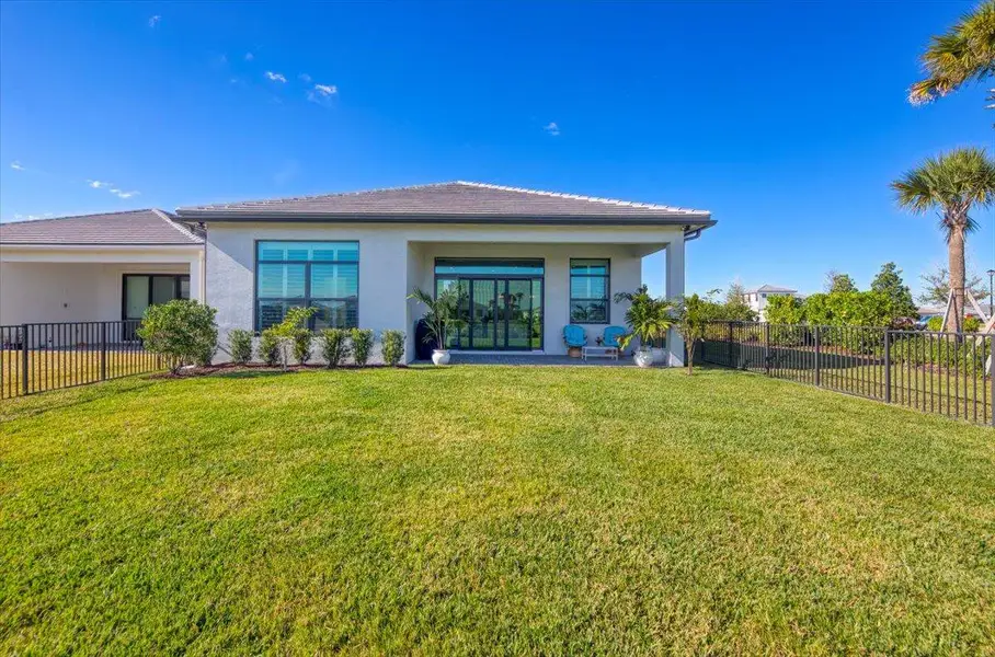 Oversized corner fenced backyard